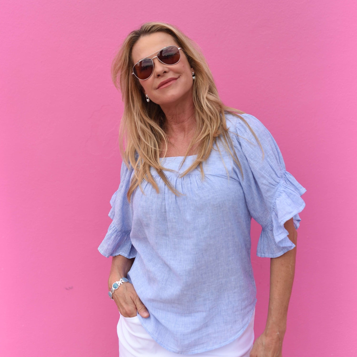Woman wearing a black bikini and sarong on the beach