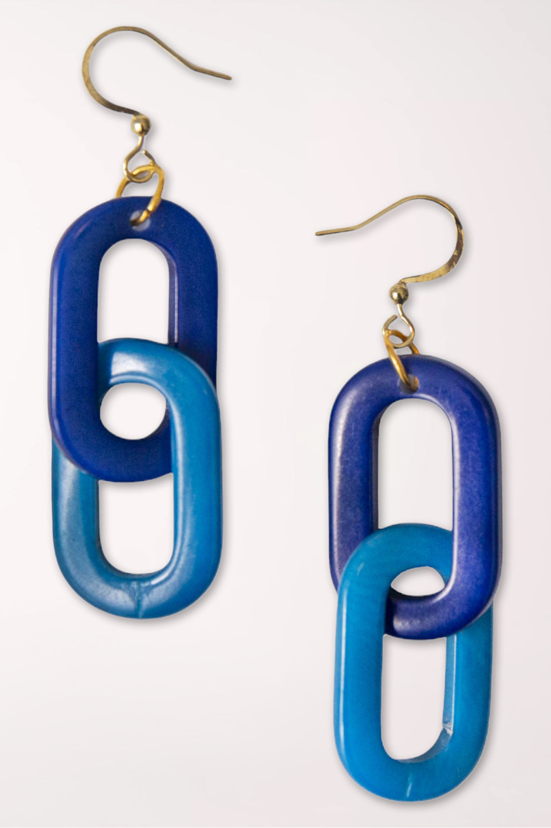 Blue and purple chain-link earrings on a white background