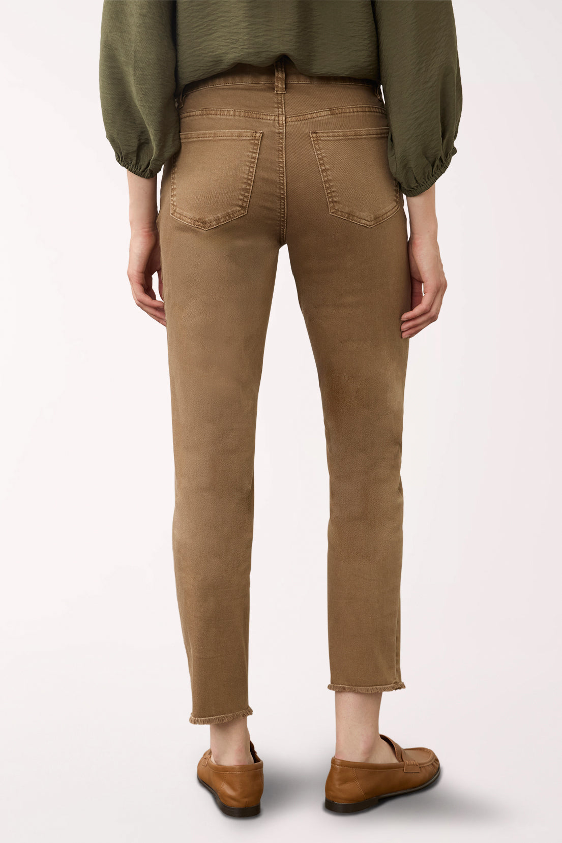 Woman wearing brown ankle pants