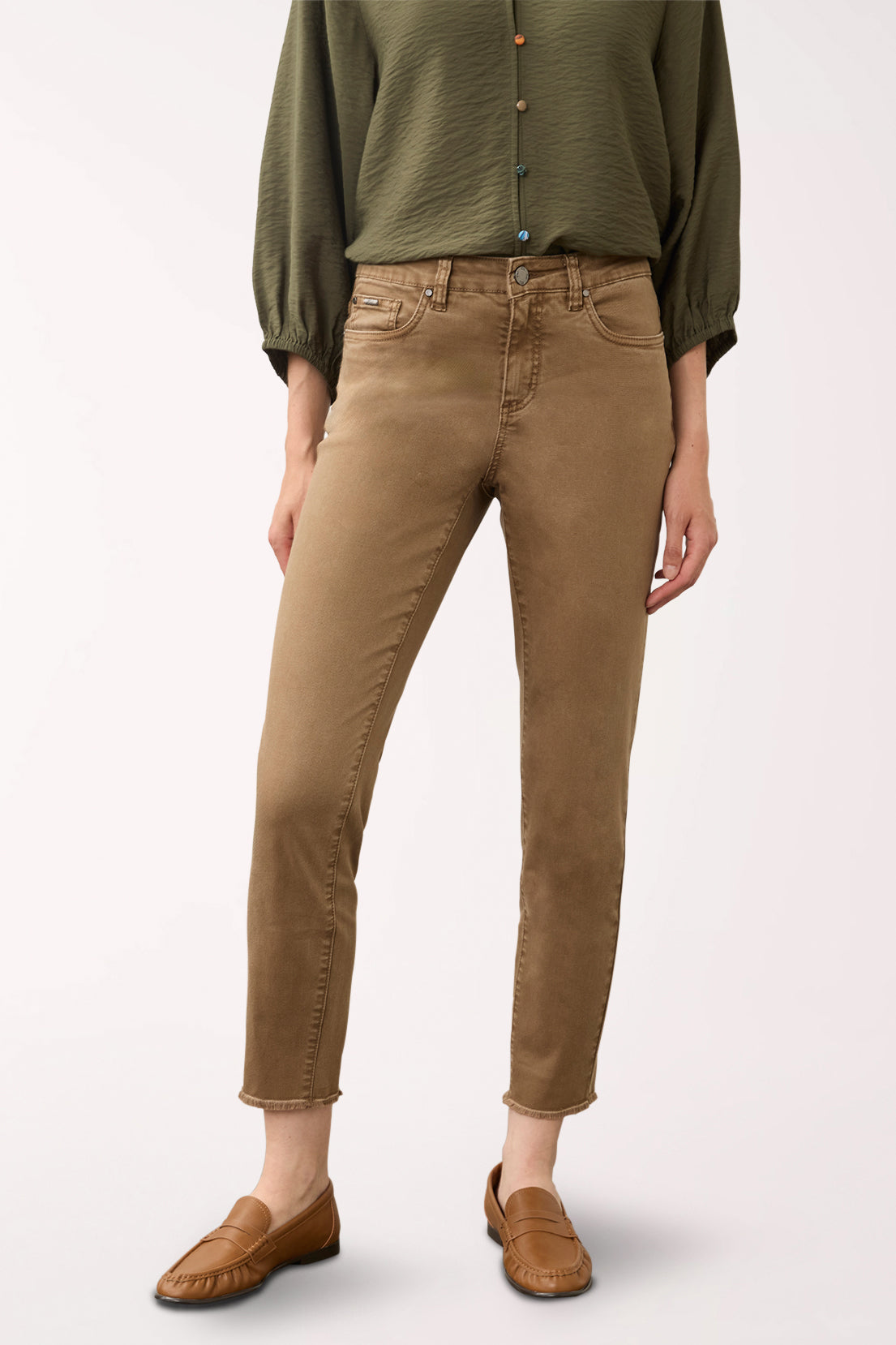 Woman wearing brown ankle pants