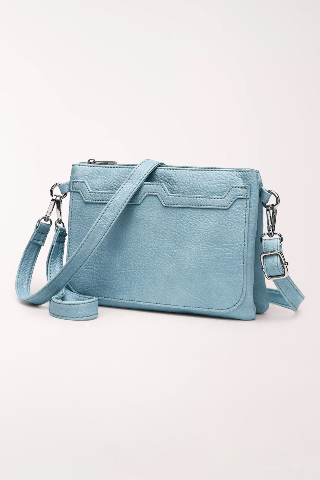 Back view of the baby blue 22 Tote Two-Sided Crossbody Bag showing a slip pocket with decorative stitched trim and the crossbody strap.