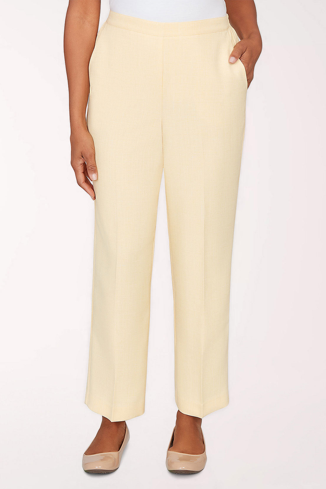 Light yellow pants worn by a person on a white background