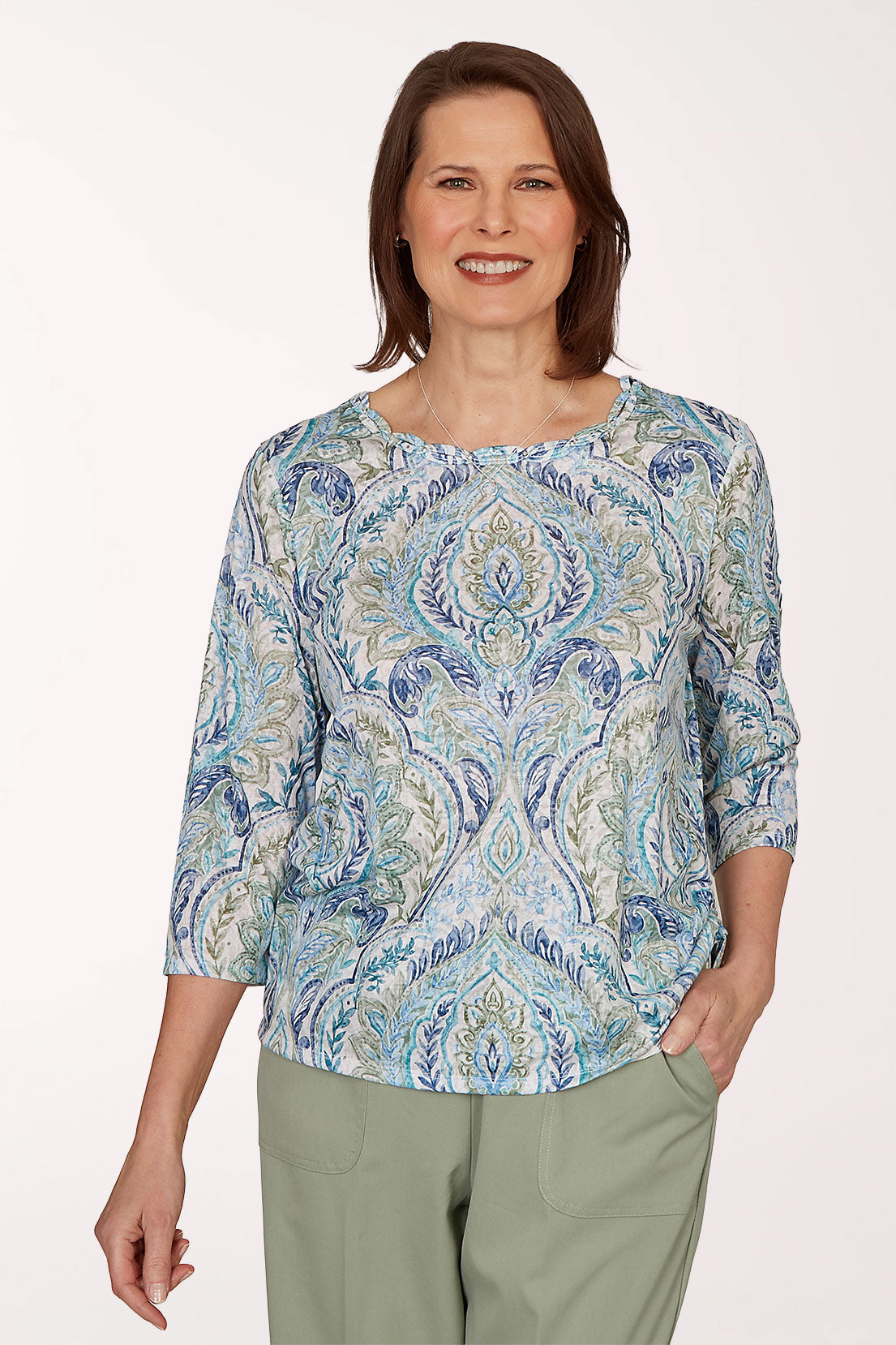 Woman wearing a blue paisley 3/4 sleeve top