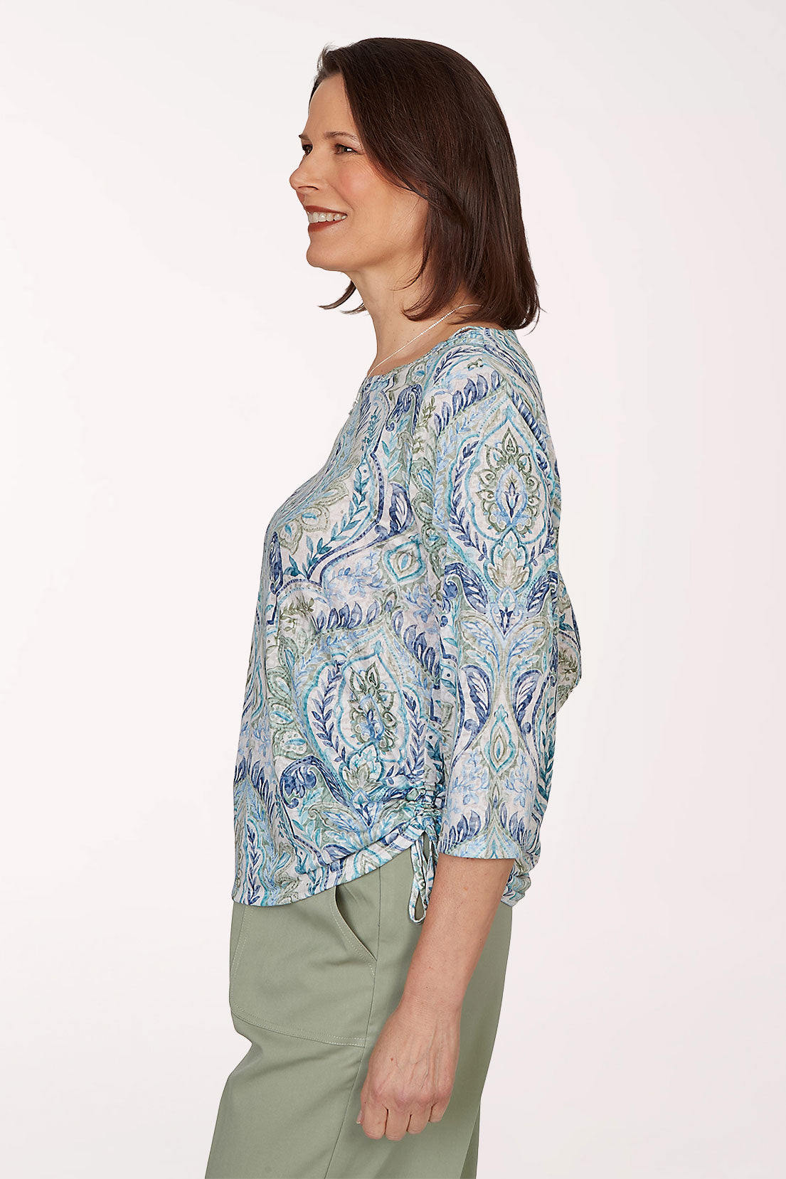 Woman wearing a blue paisley 3/4 sleeve top