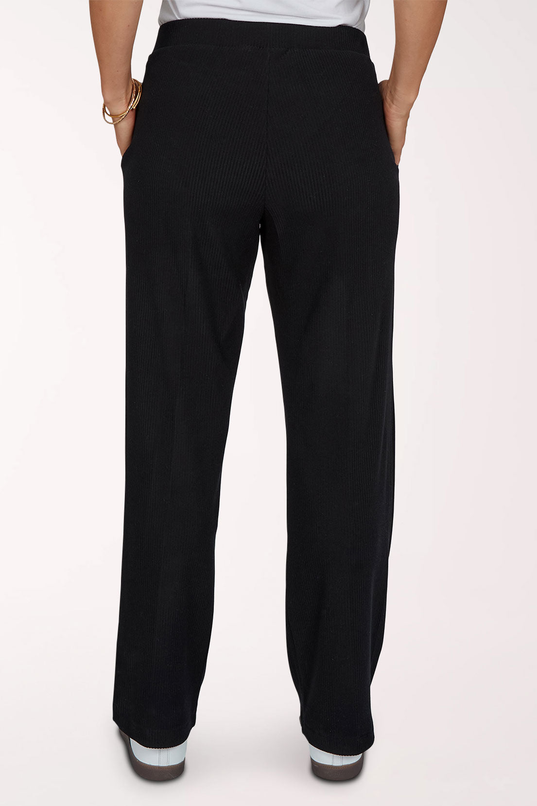 Woman wearing black full-length lounge pants