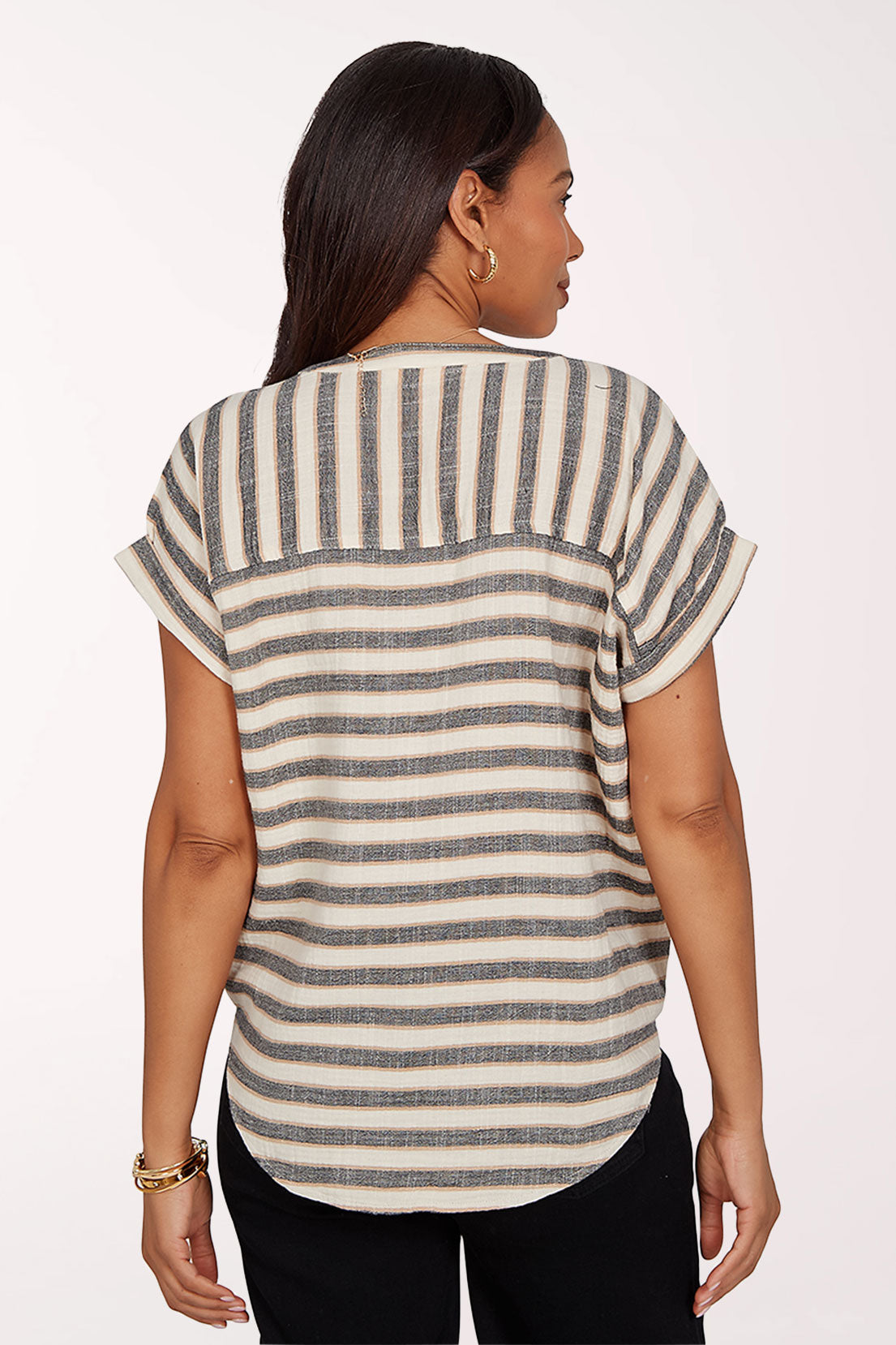 Woman wearing a striped top with a knot detail on a white background
