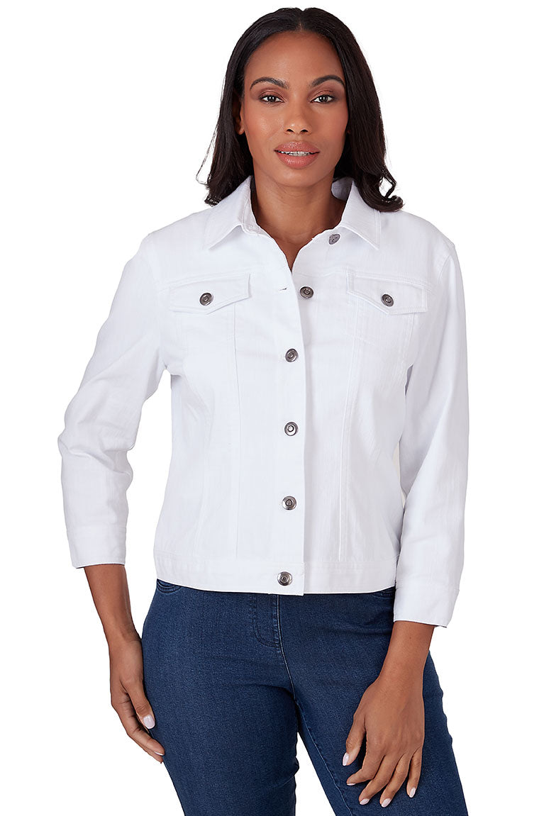 A front shot of a model wearing a white button-front denim jacket with a foldover collar, 3/4-length sleeves with buttoned cuffs, and dual buttoned chest pockets.