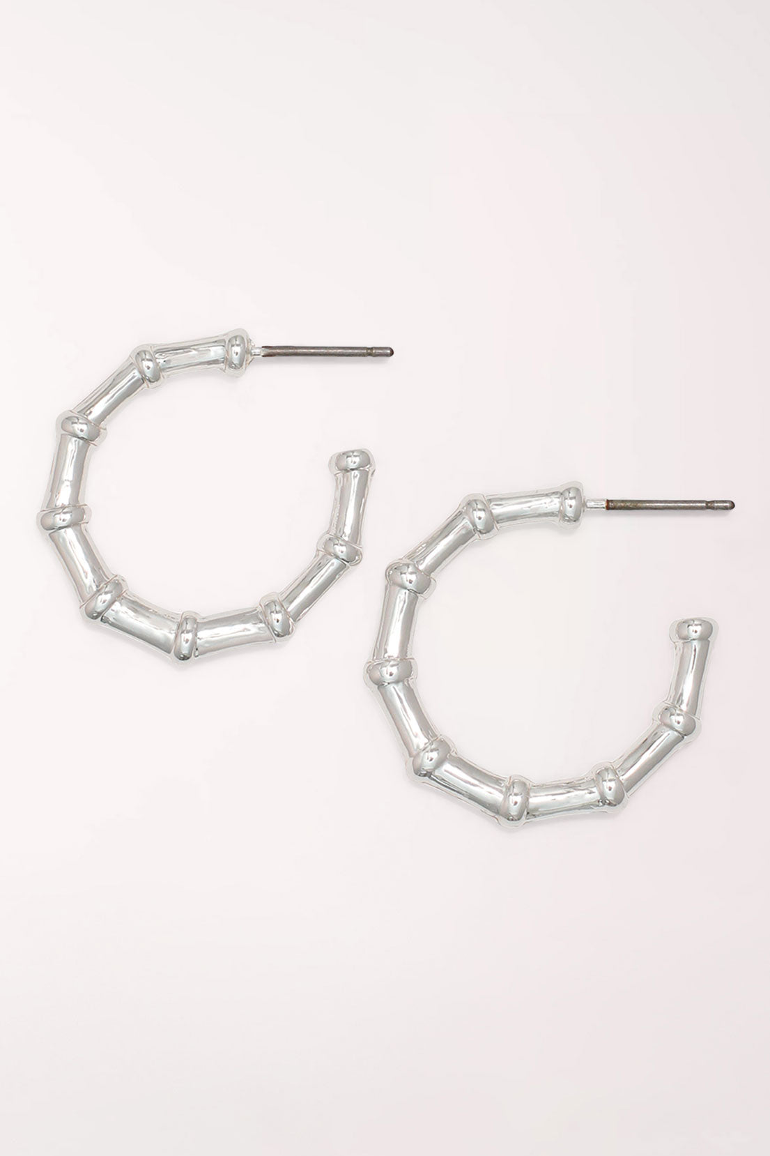 Pair of Periwinkle Silver Bamboo Hoop Earrings: brushed silver-tone open hoops shaped like segmented bamboo, on posts.