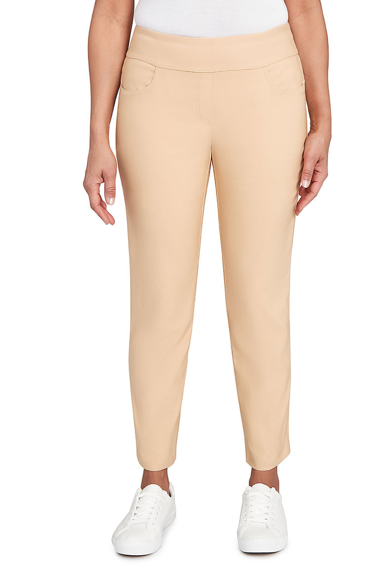 A front shot of a model wearing jute pants paired with white sneakers.