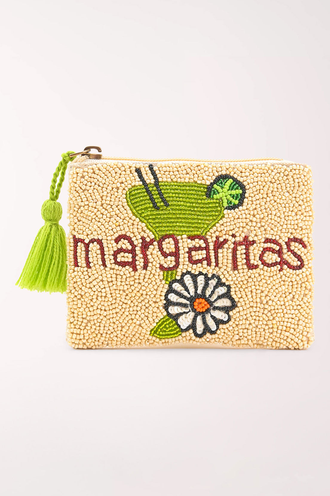 A small cream-colored beaded pouch with a bright green tassel and embroidered floral details, a margarita glass, and the word "margaritas" shown on a light off-white background.