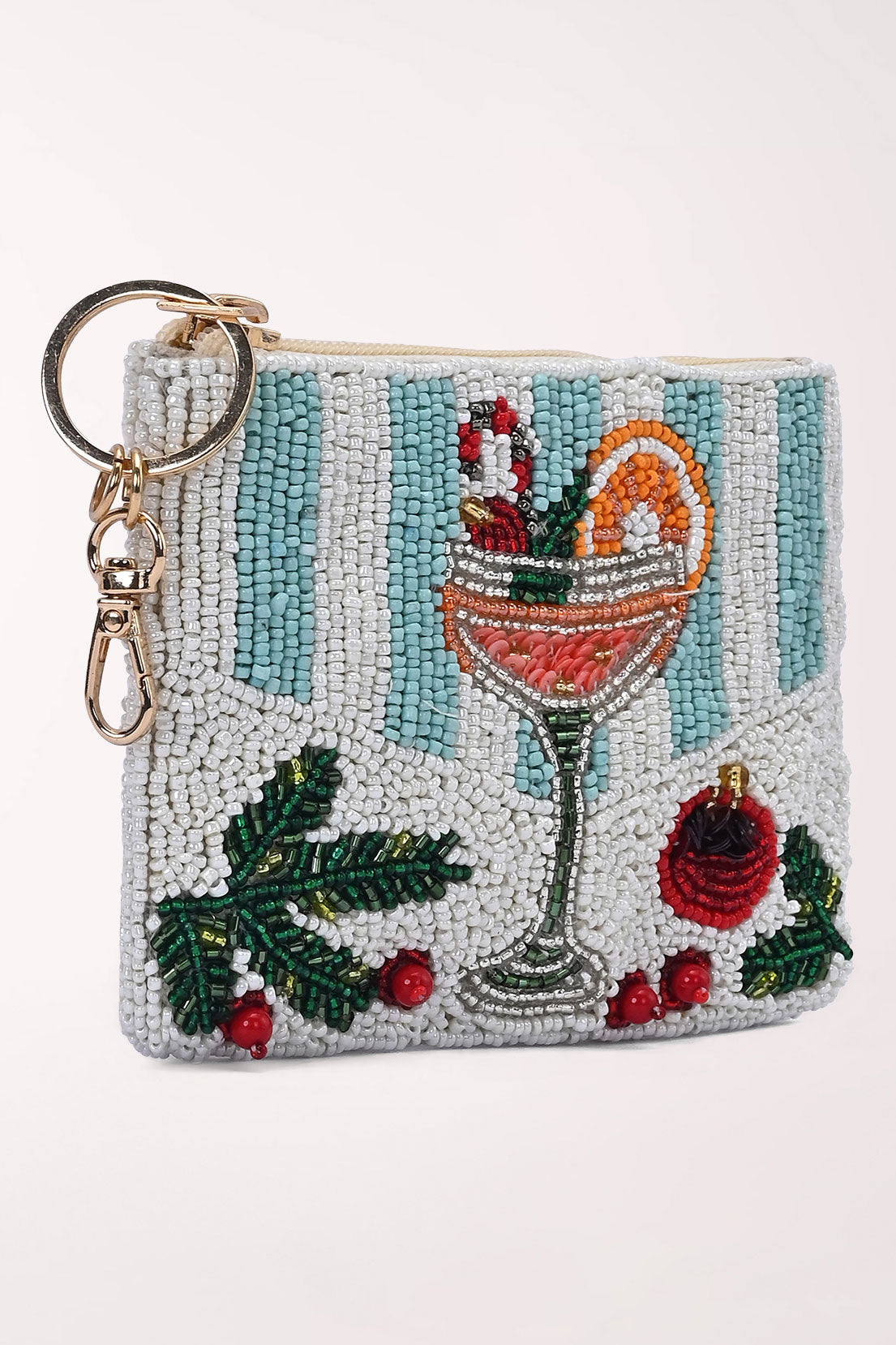 Front view of the Merry Mimosa beaded coin pouch showing the mimosa glass, holly and red ornament on a white and pale blue striped background.