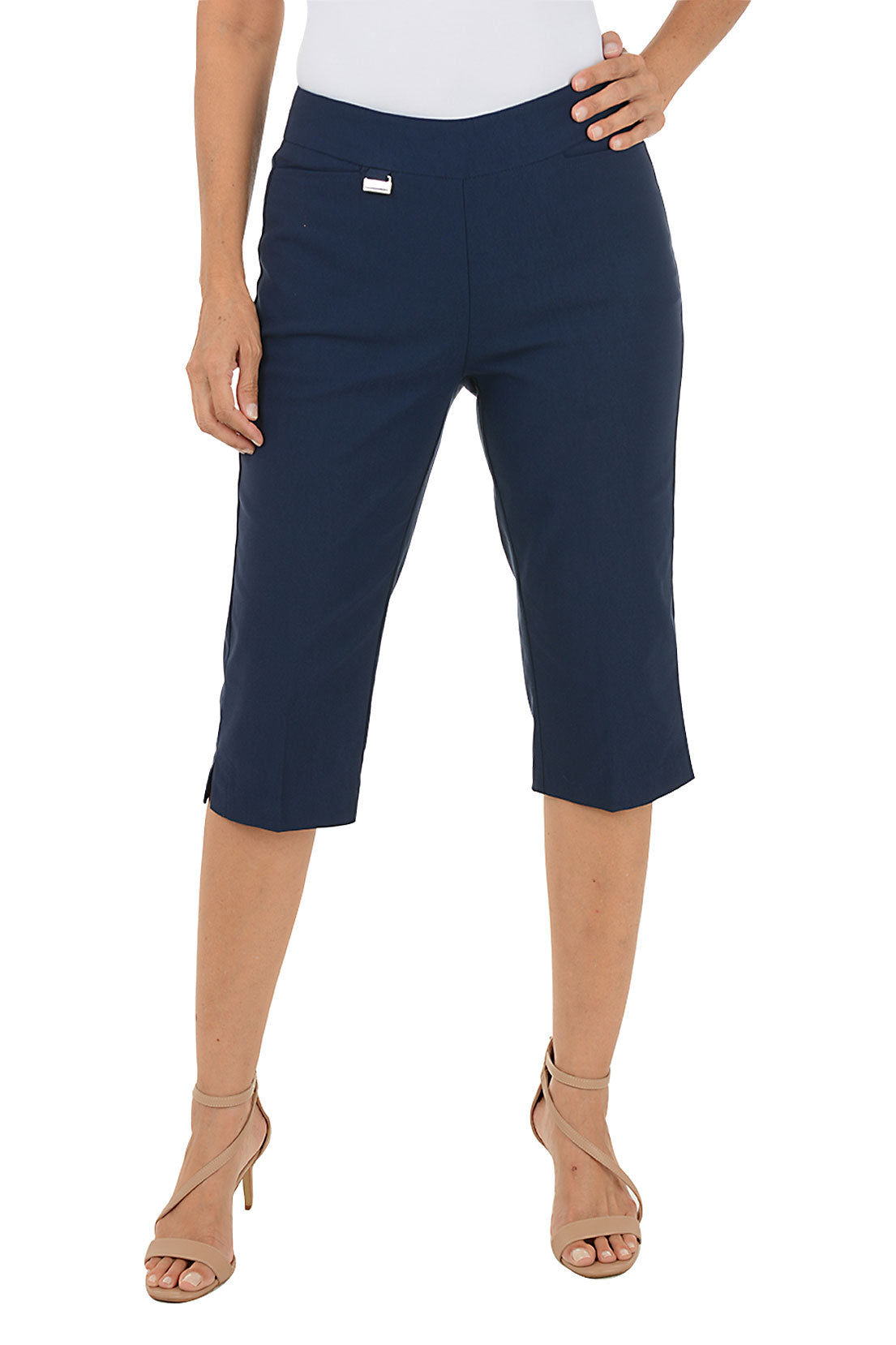 Navy blue capri pants worn by a person on a white background