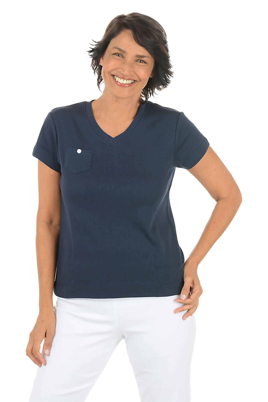 Woman wearing a navy blue scrub top with a pocket on a white background front shot.