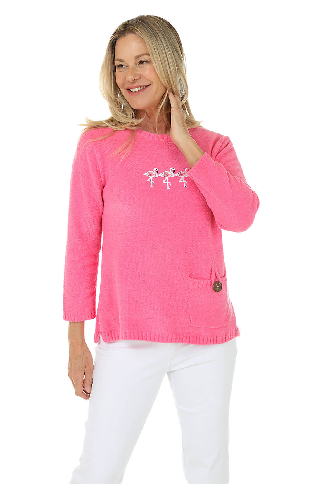 Woman wearing a pink sweater with a design on a white background