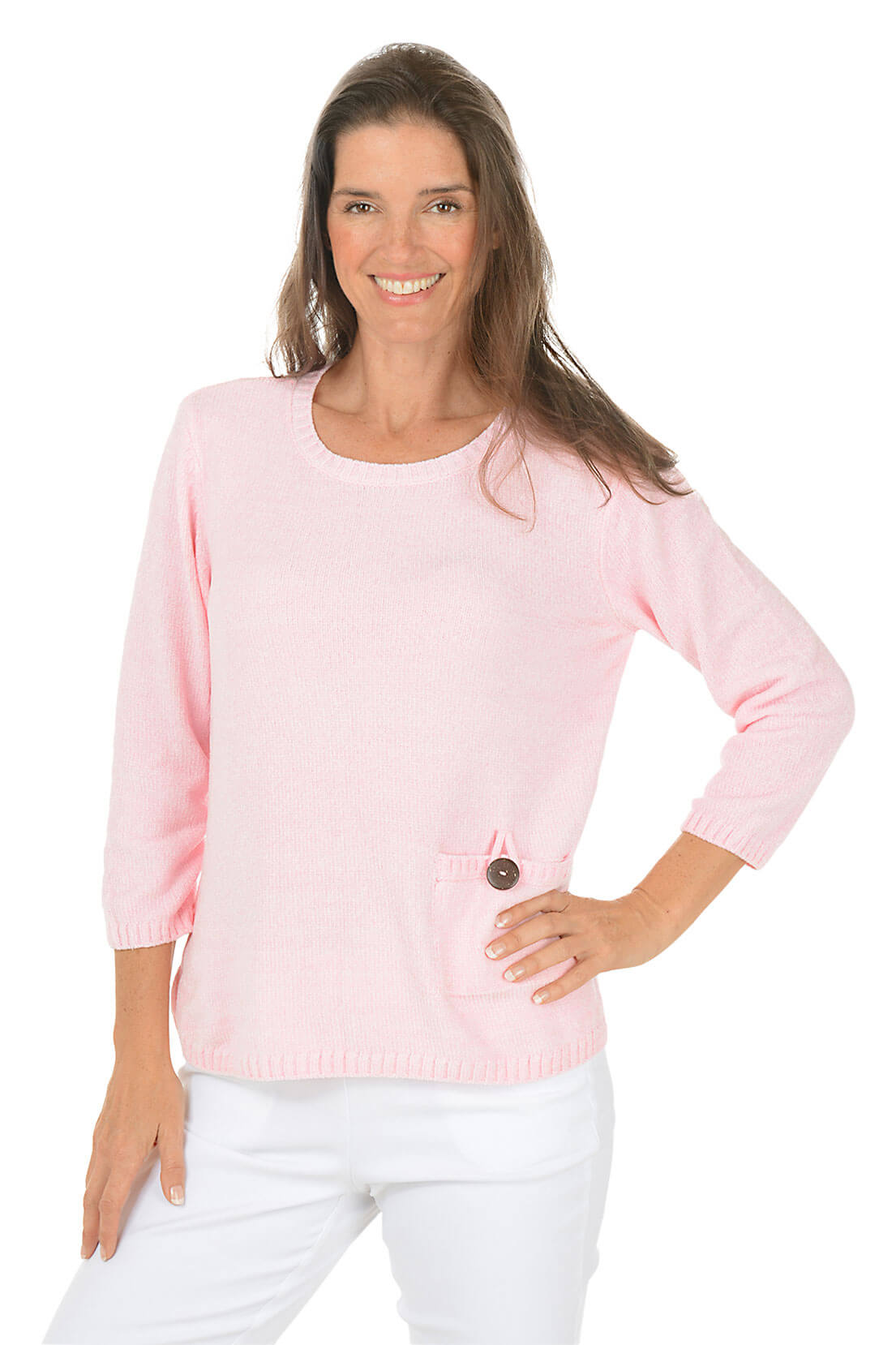 Woman wearing a pink sweater with a button on a white background