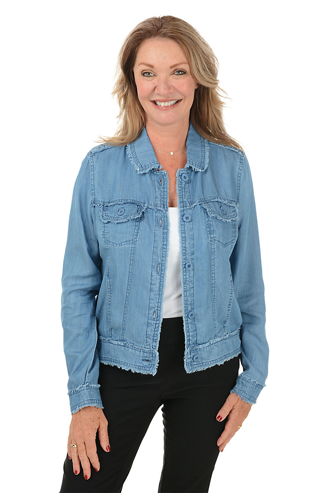 A woman wearing a blue denim jean jacket with a frayed hem.