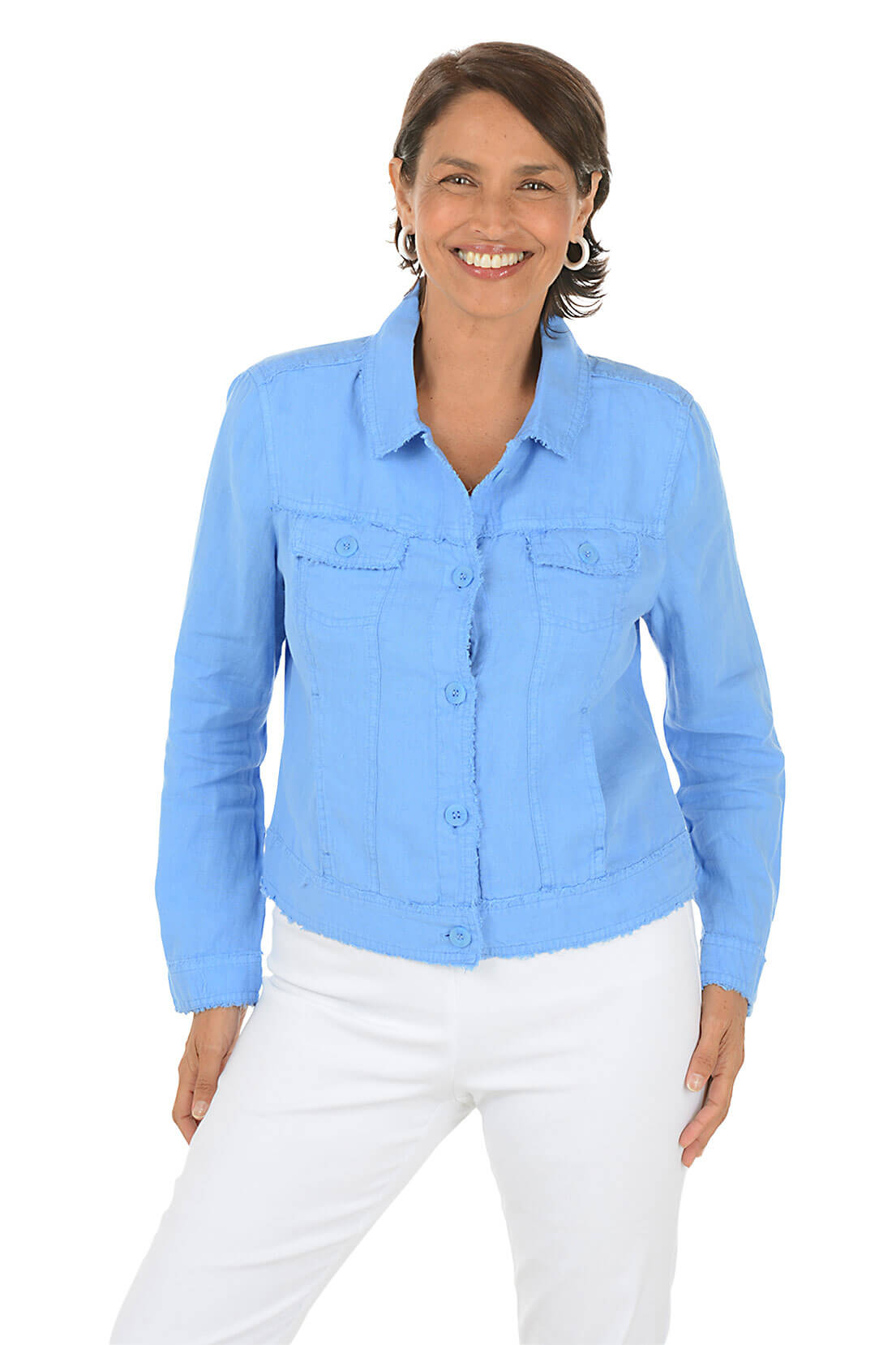 Woman wearing a periwinkle denim shirt and white pants on a white background