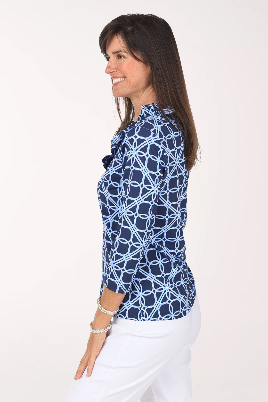 Side view of the Blue Lattice Rings Ruffle Neck Top showing the ruffled neckline and 3/4-length sleeves.
