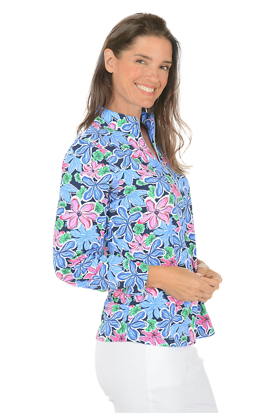 Woman wearing a colorful floral blouse on a white background