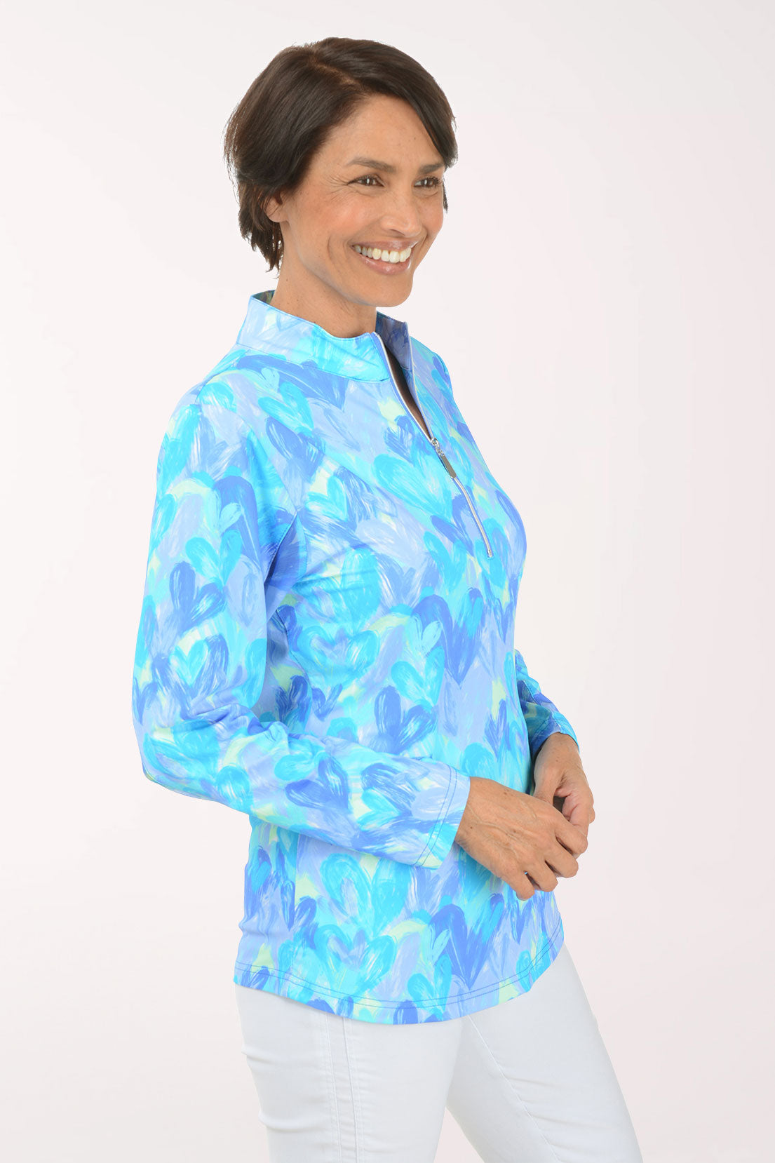 Woman wearing a blue and white patterned shirt on a white background