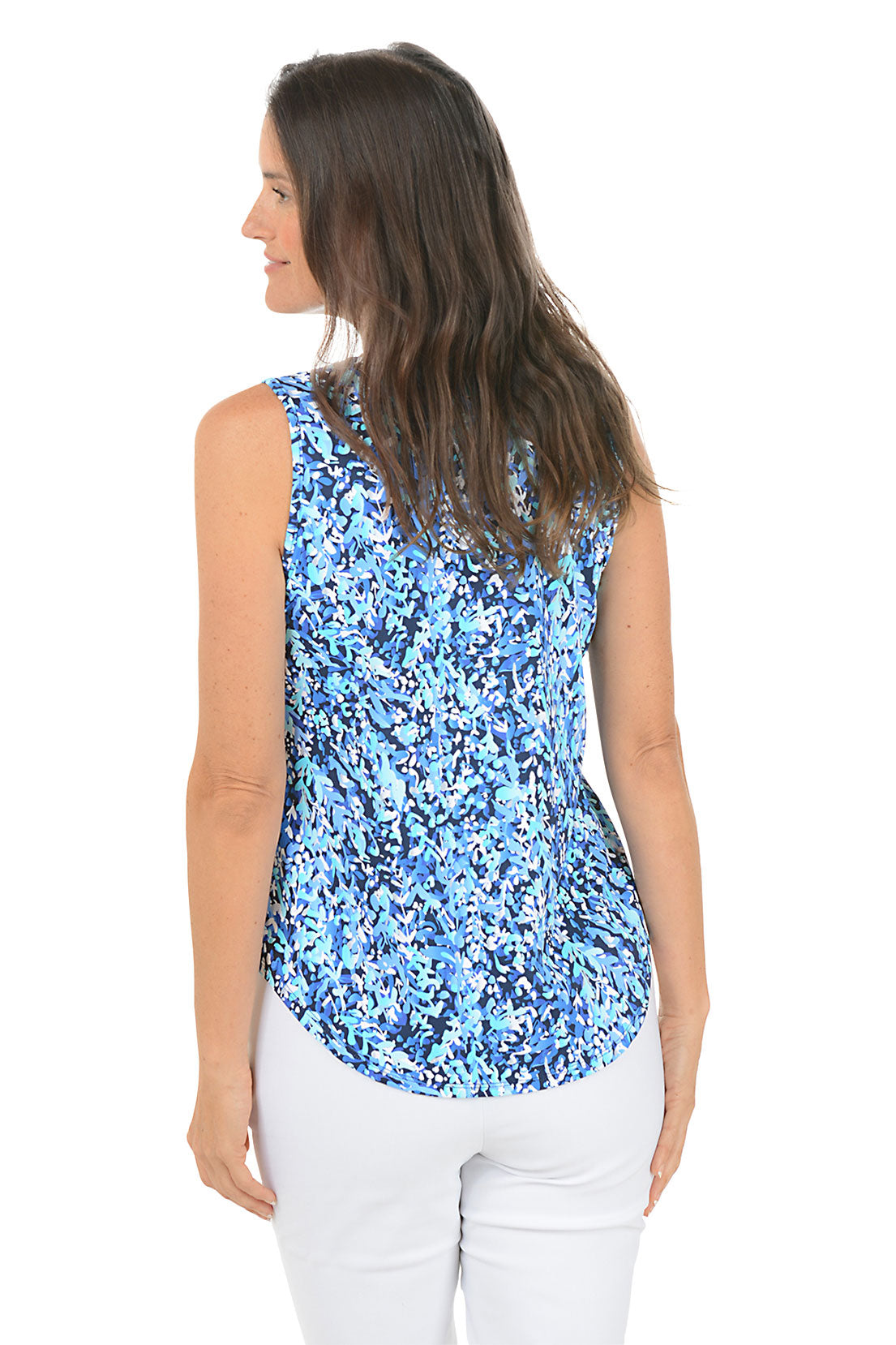 Woman wearing a blue floral sleeveless top on a white background. Back shot.