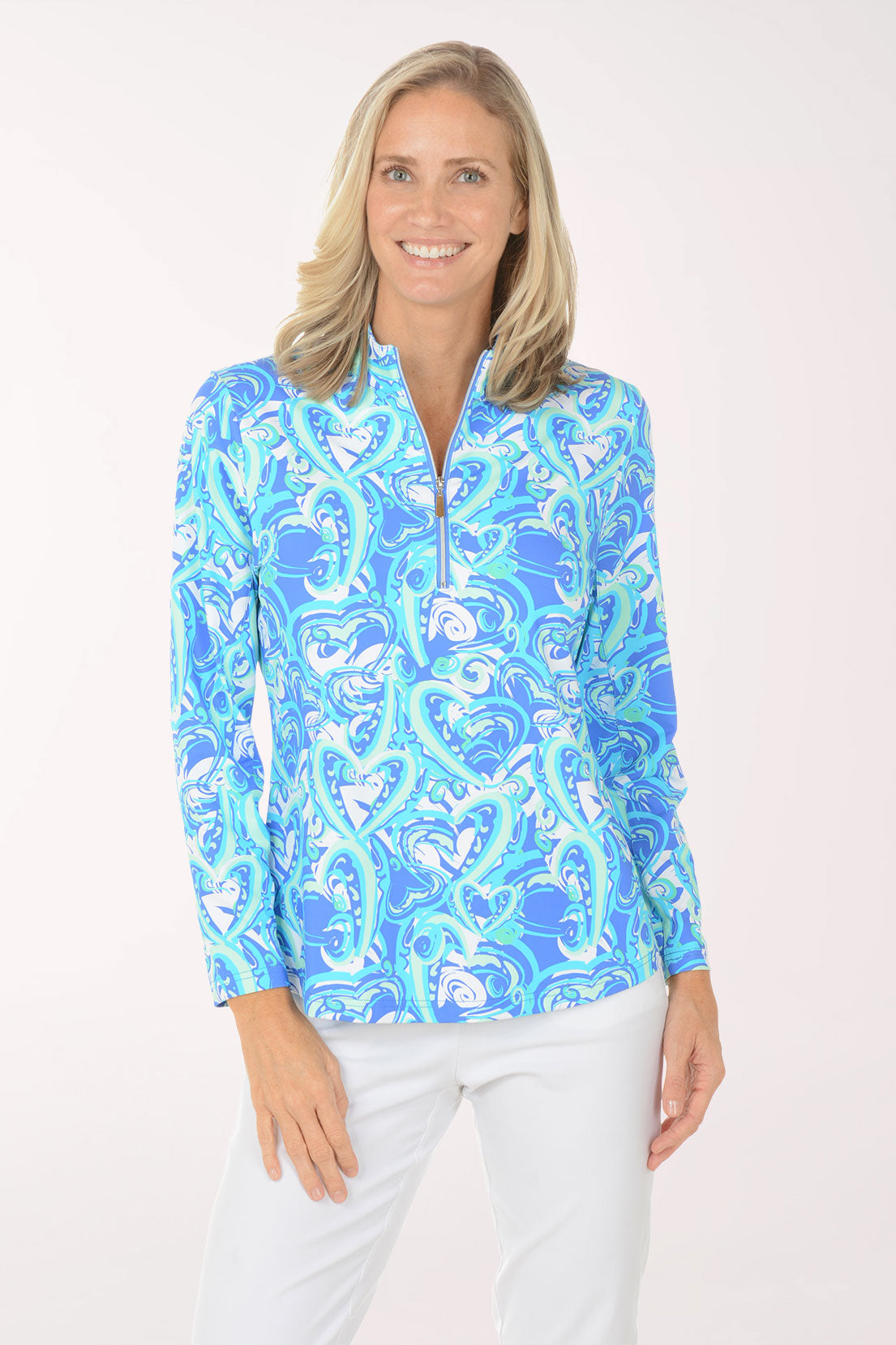 Woman wearing a blue and white patterned blouse on a white background