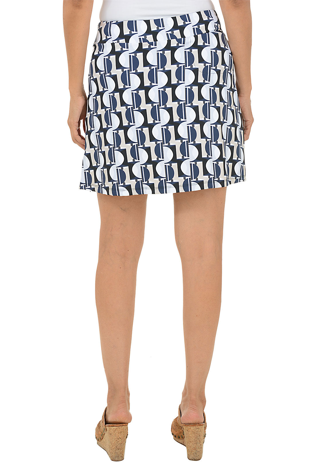 Patterned skirt worn by a person on a white background. Back shot.