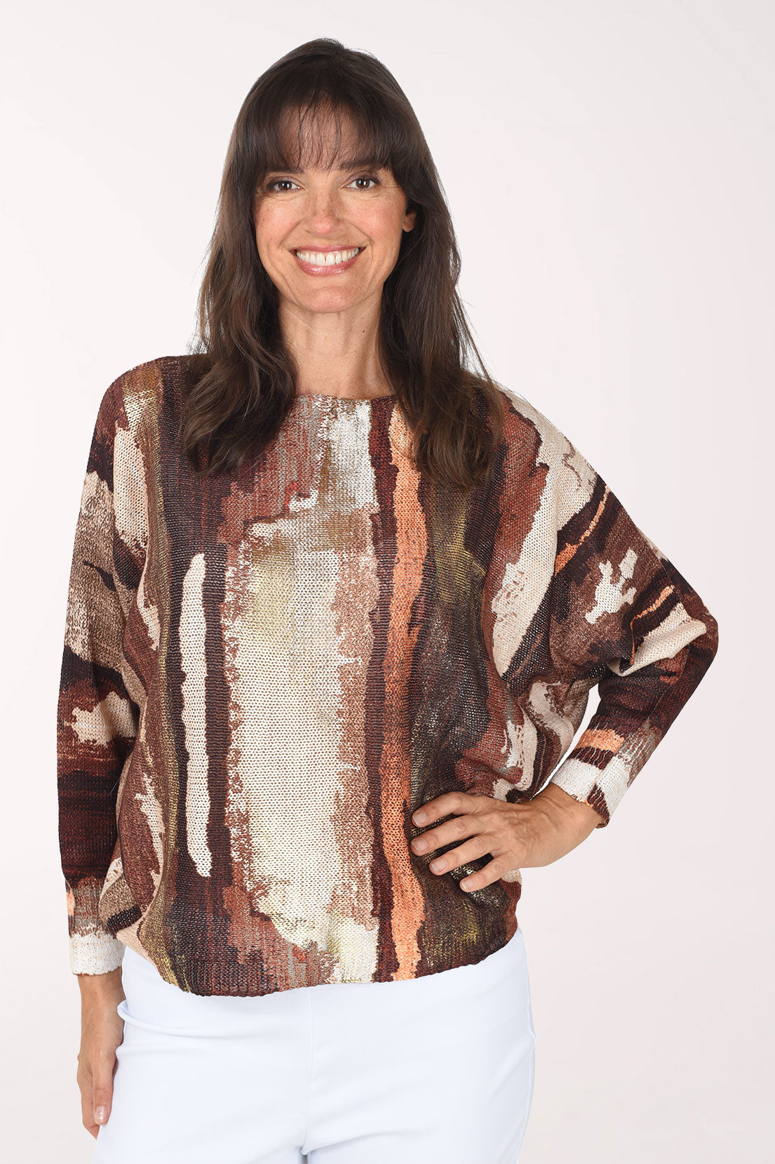 Front view of the brown paintbrush sweater, showing a wide ribbed crew neckline, relaxed dolman sleeves and a hem that sits at the hip