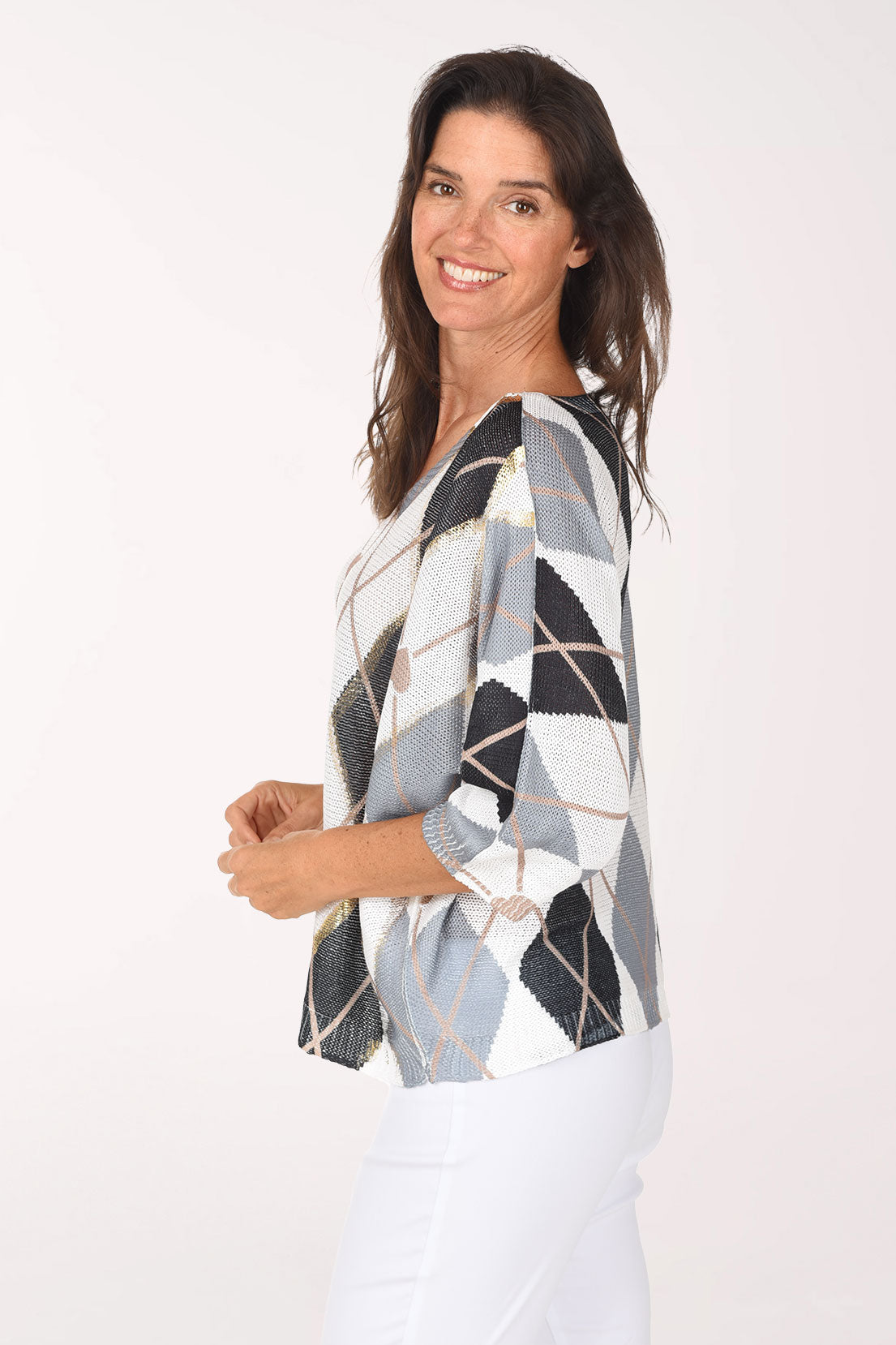 Side view showing the relaxed fit and the charcoal, grey and white argyle print wrapping around the sleeve