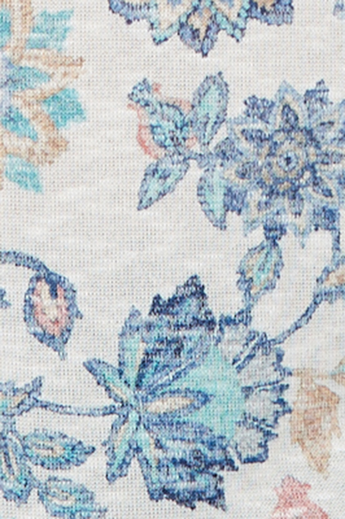 Close-up of the Ivory Floral fabric showing blue, teal and peach flowers on an ivory knit.