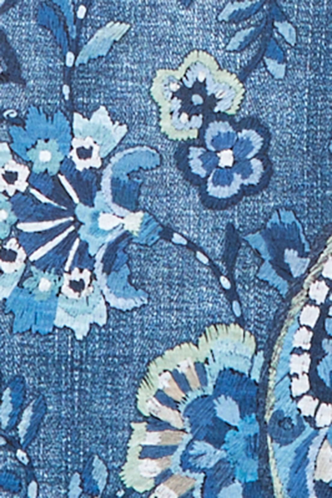 Close-up of the Ann Arbor Paisley fabric showing blue, white and pale aqua paisley and floral motifs.