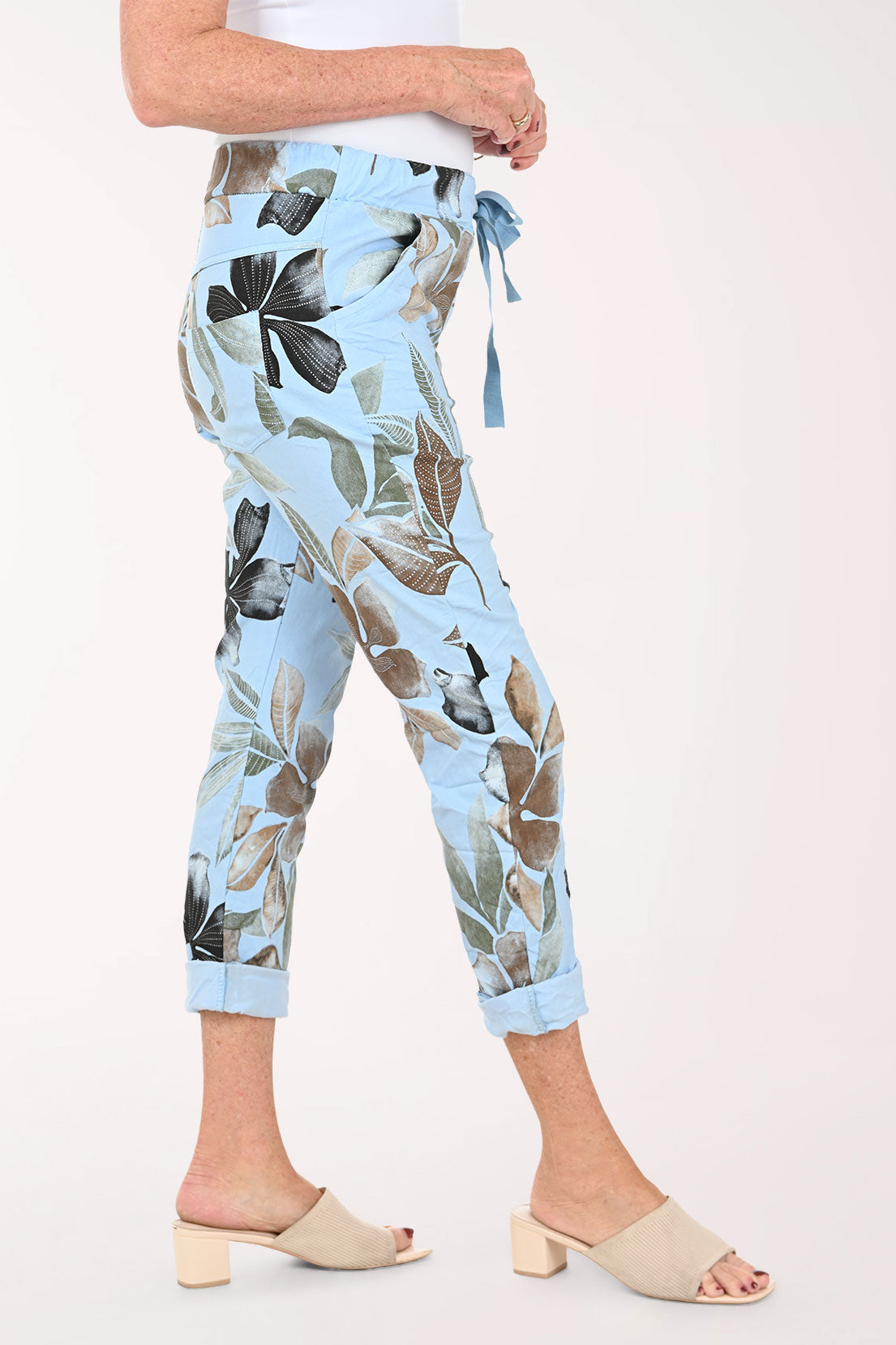 Woman wearing blue floral jogger pants