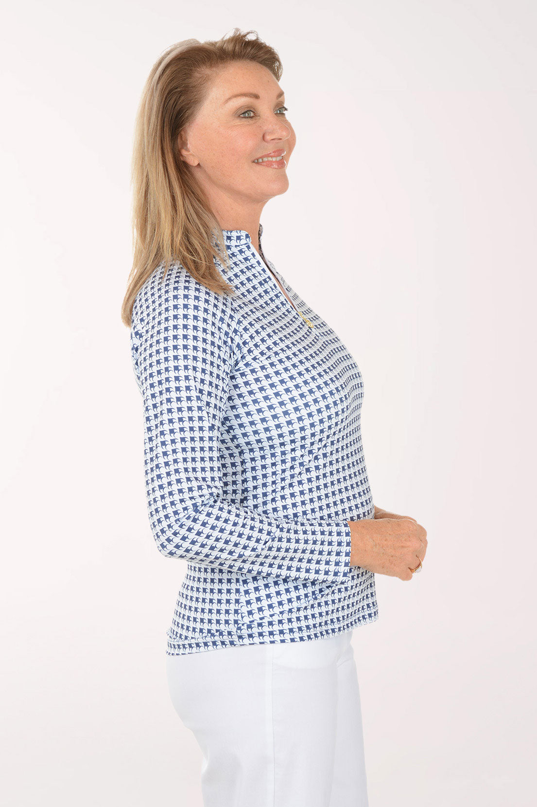 Woman wearing a blue checkered shirt against a white background