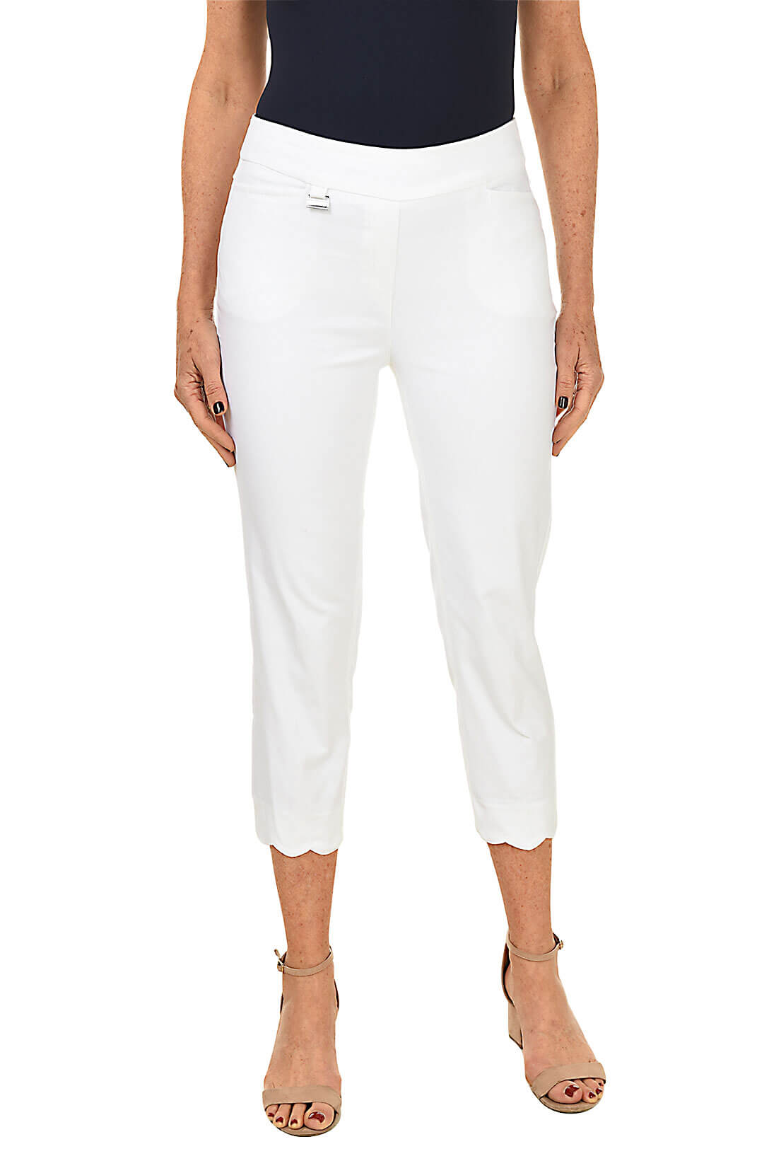 White pants worn by a person on a white background