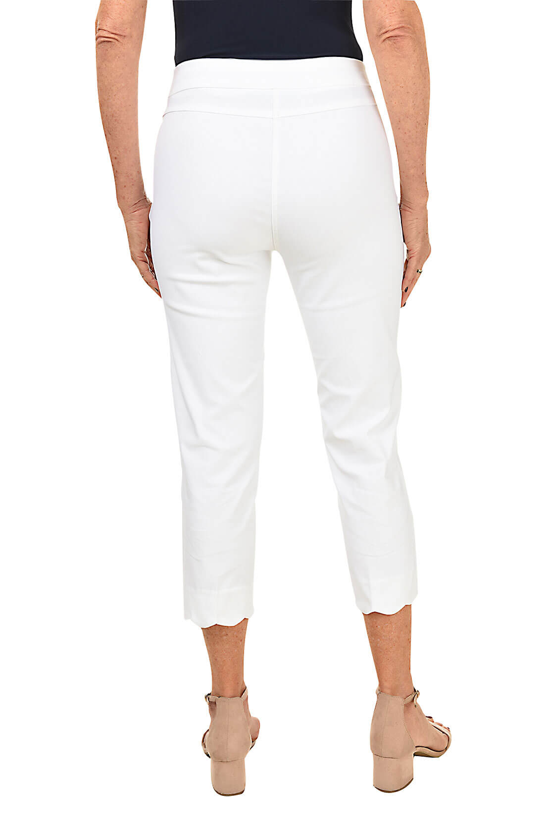 Person wearing white pants on a white background
