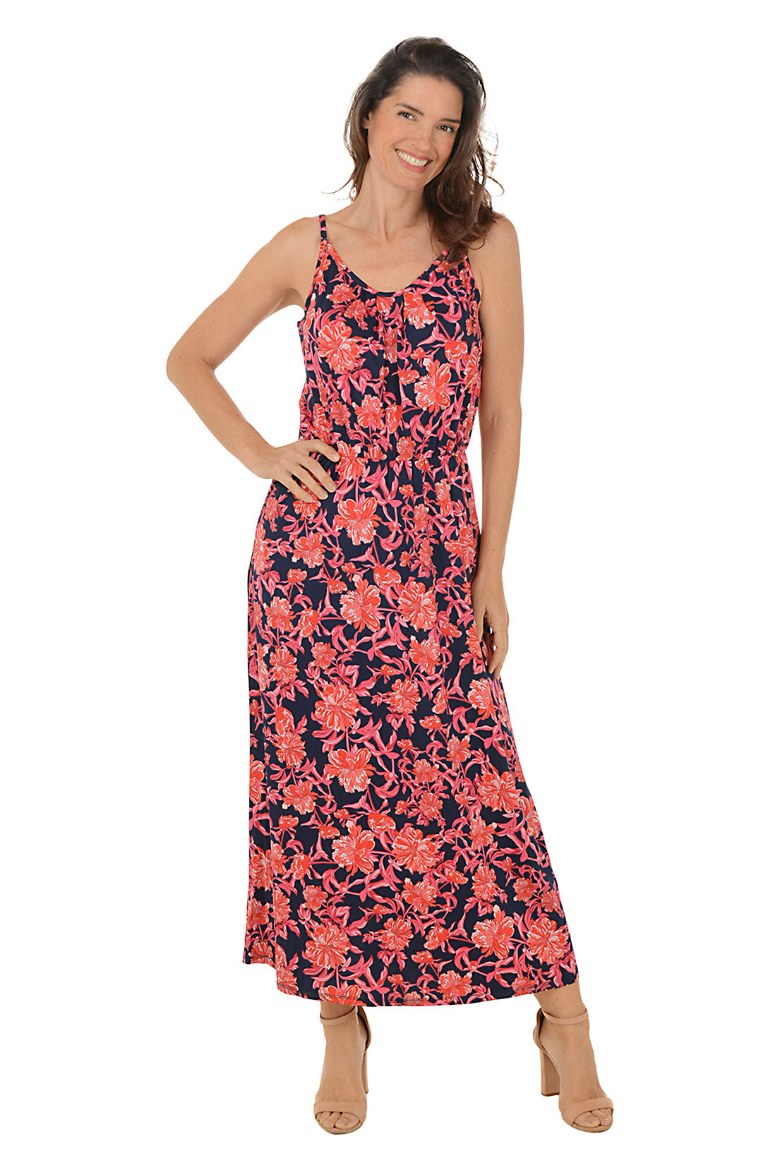 A sleeveless maxi dress with a floral pattern, featuring a scoop neckline, adjustable straps, and a straight hemline. The dress is worn by a model posing against a white background.