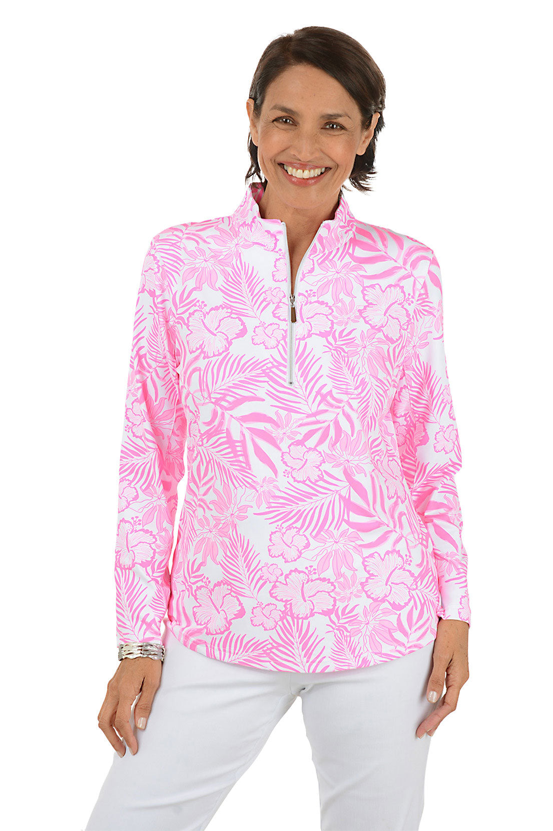 Woman wearing a pink floral patterned shirt with a white background.
