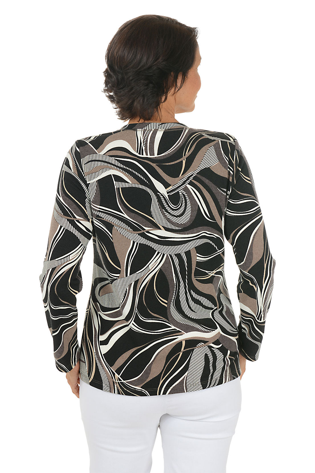 Woman wearing a patterned long-sleeve top and white pants on a white background. Back shot.