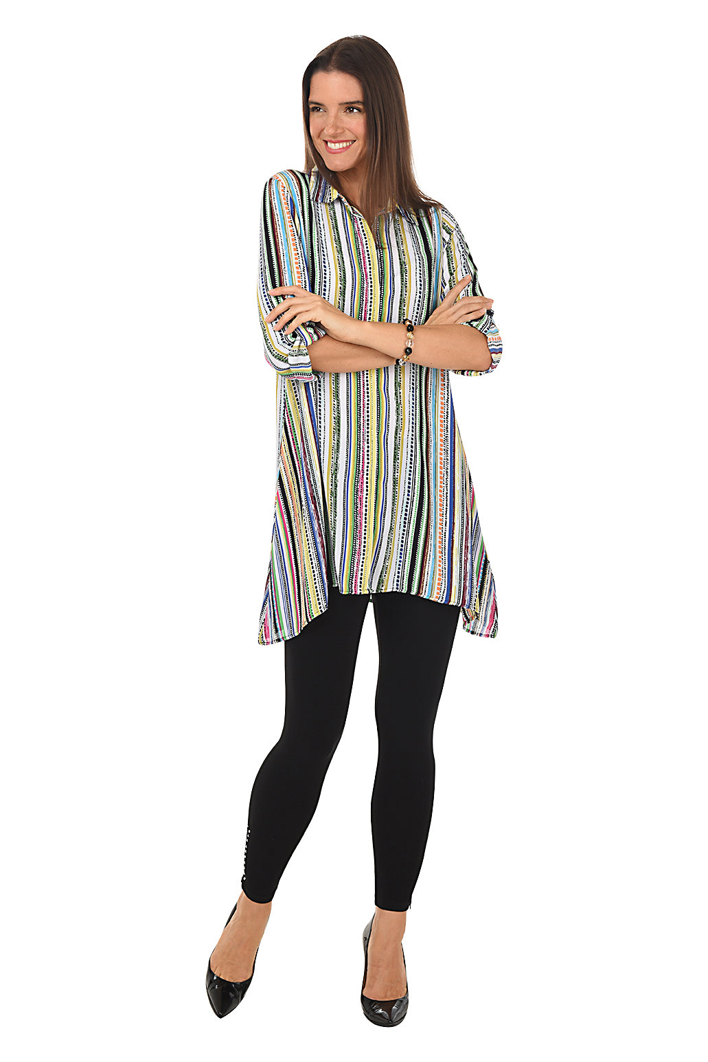 A model wearing black pull-on legging pants with studded embellishment and a zip-up hemline. Full length shot.