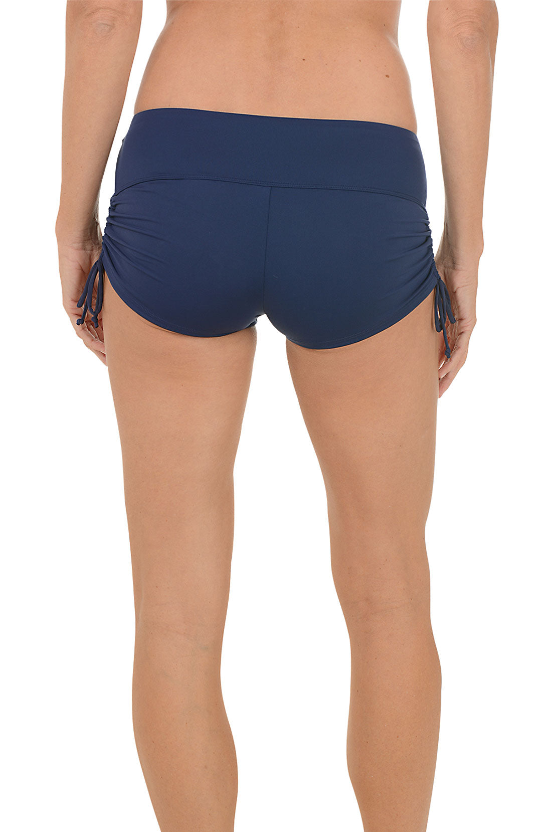 A woman wearing a navy swim boxer. Back shot.