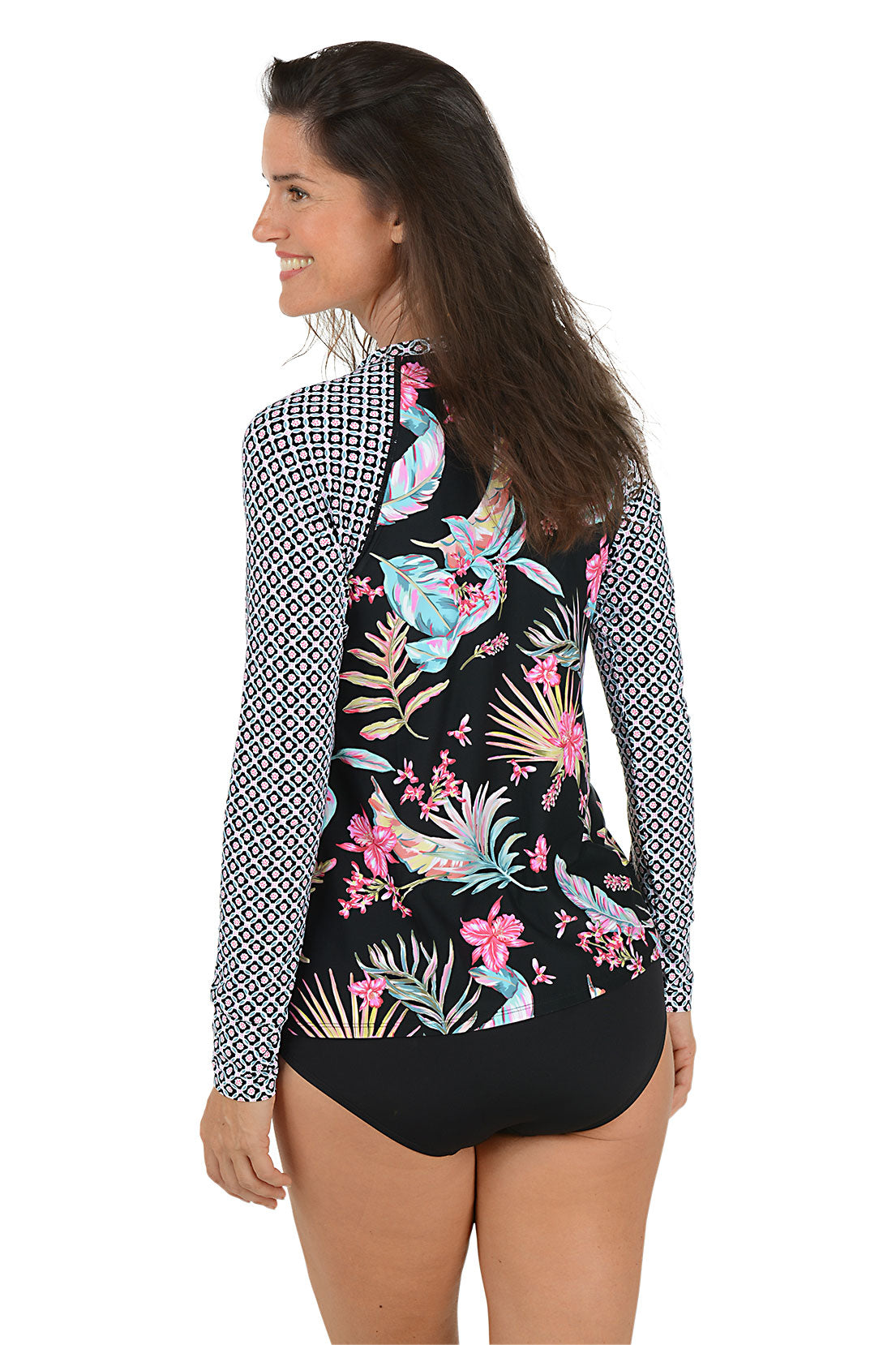 Woman wearing a floral print long-sleeve rash guard with a patterned overlay on a white background. Back shot.