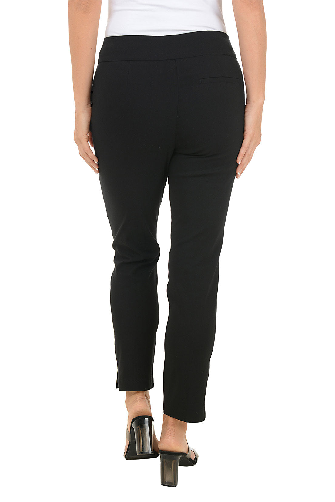 Person wearing black pants on a white background. Back shot.