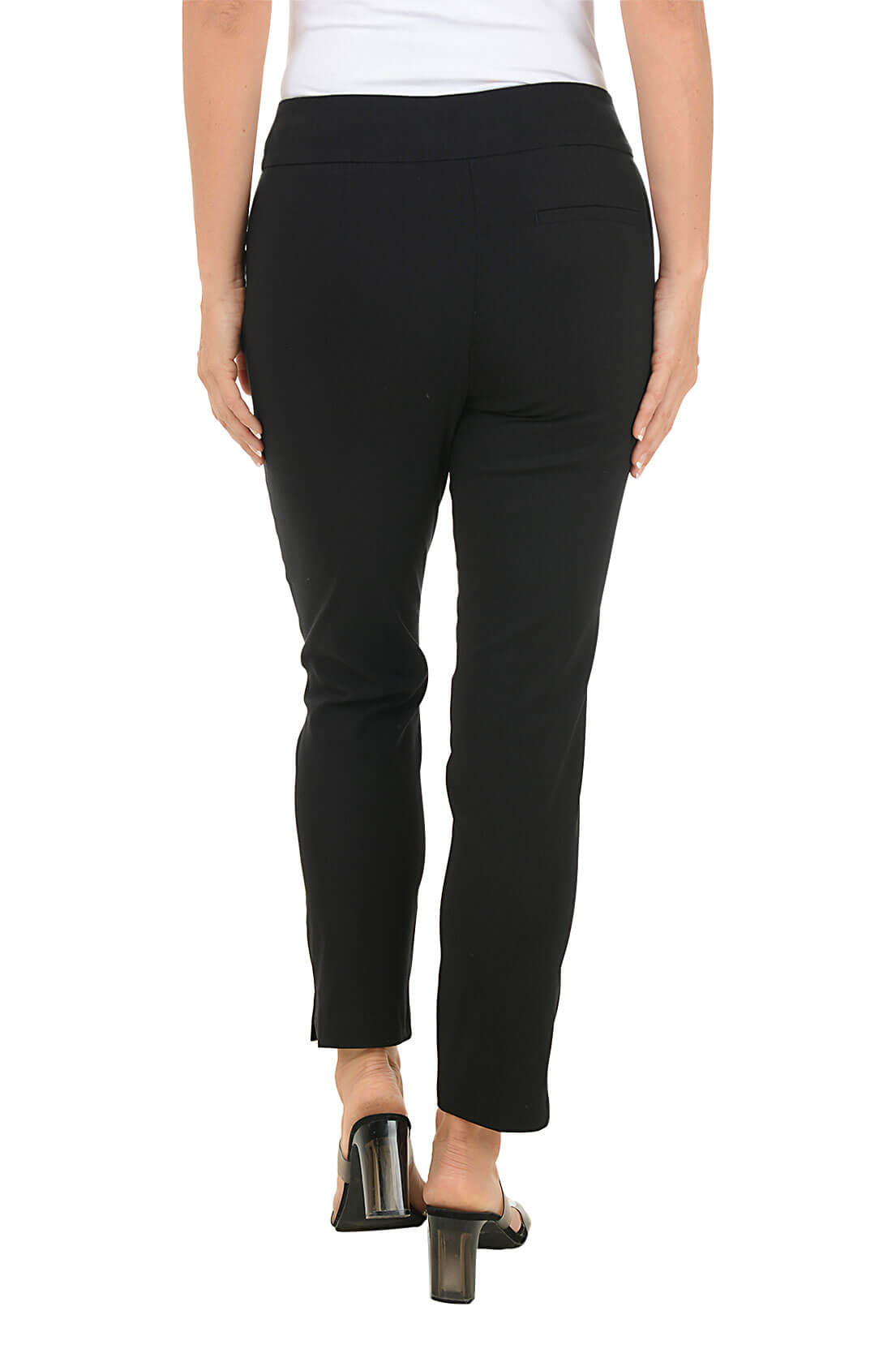 Black pants worn by a person on a white background