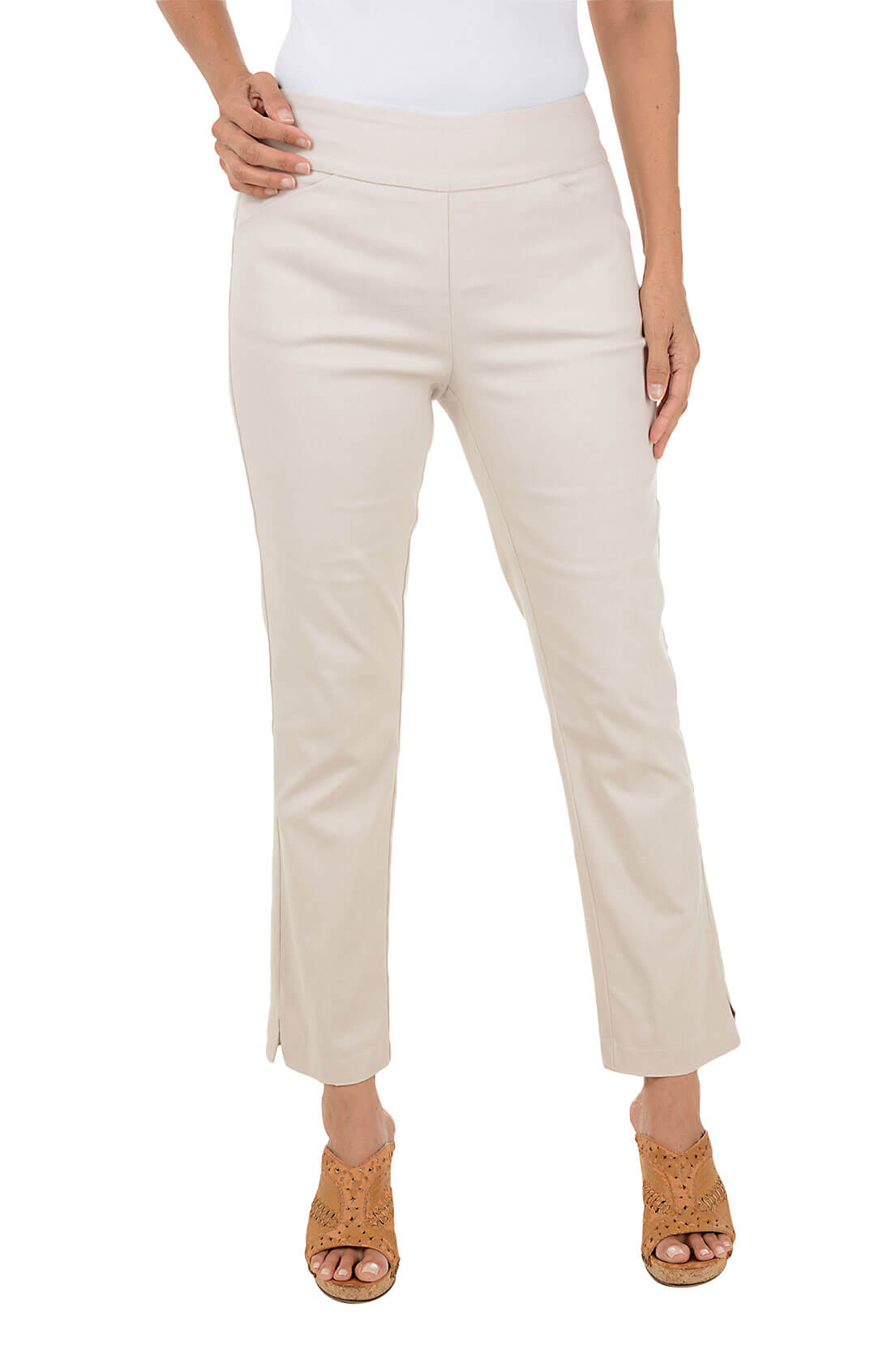 Beige pants worn by a person on a white background