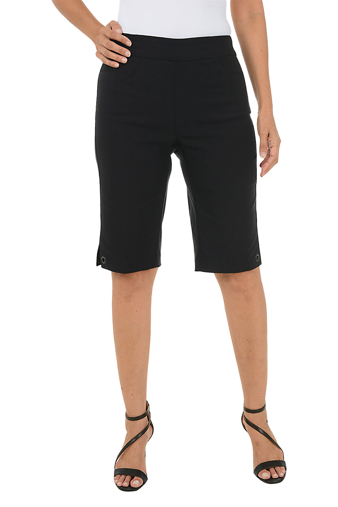 Person wearing black shorts on a white background.