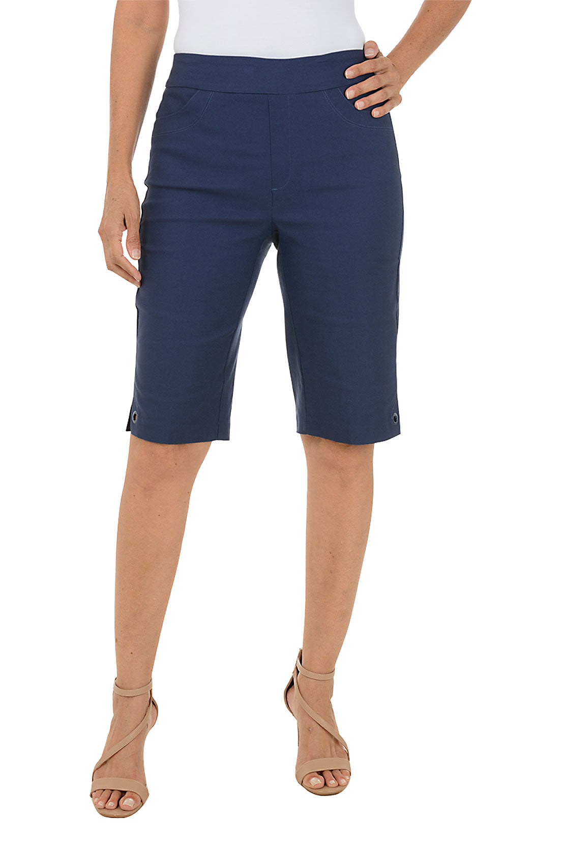 Navy blue shorts worn by a person on a white background