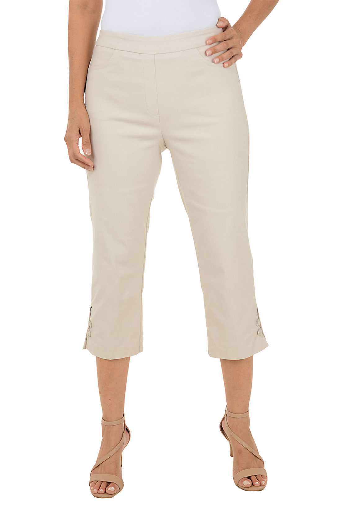 Beige capri pants worn by a person on a white background