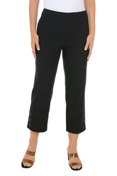 Black crop pants worn by a person on a white background.
