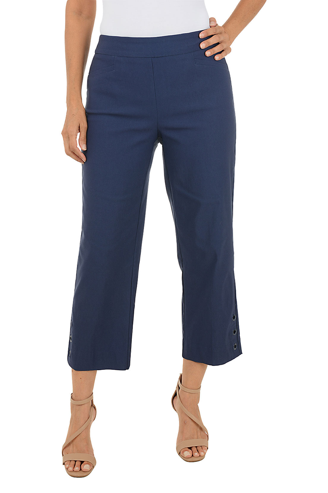 Navy blue crop pants worn by a person on a white background