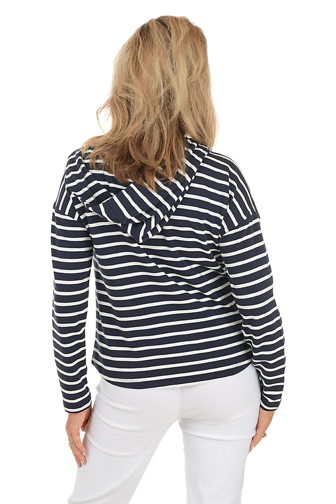 A woman wearing a navy striped French terry hoodie with a V-neckline and long dolman sleeves. Back shot.